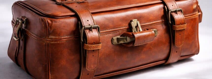 Vintage brown Italian leather suitcase with buckle straps handcrafted in Italy